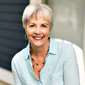 Smiling Beverley Brewer an older woman with short grey hair and a blue shirt