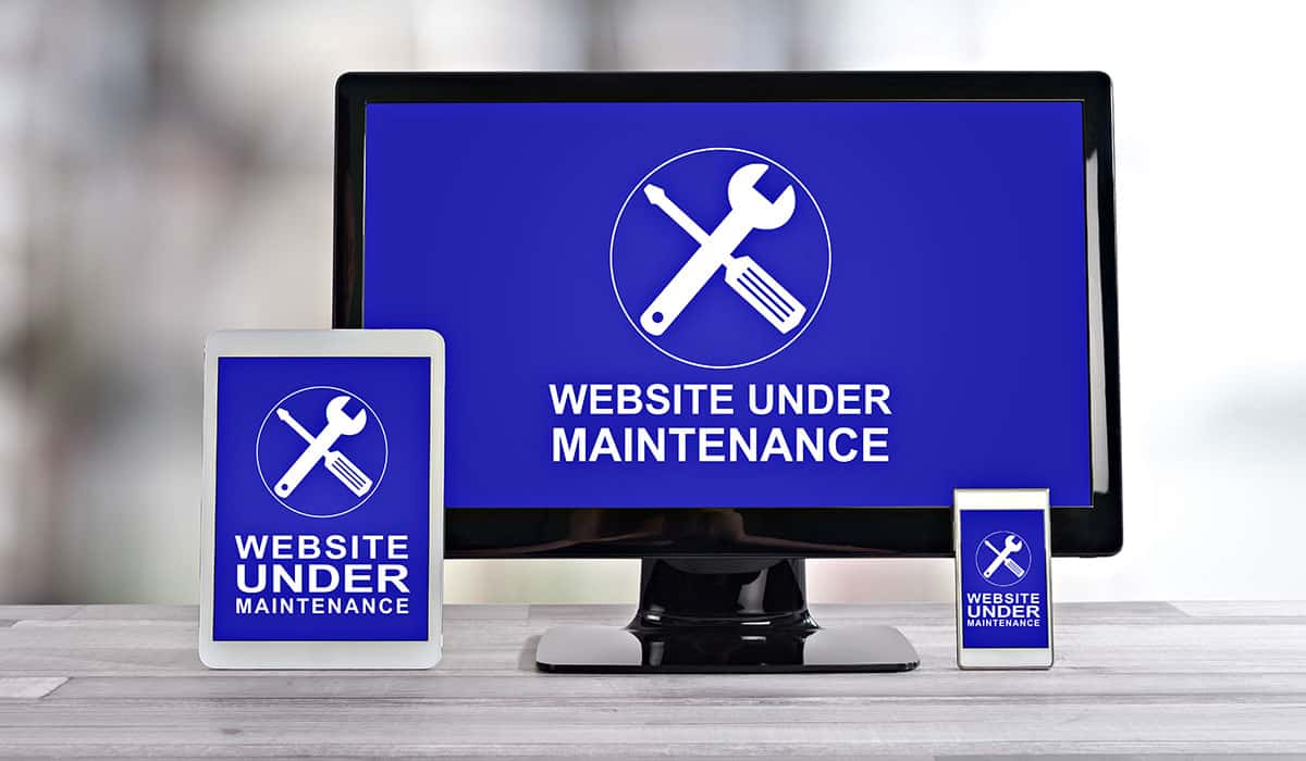 Website maintenance screen on computer, tablet, and smartphone