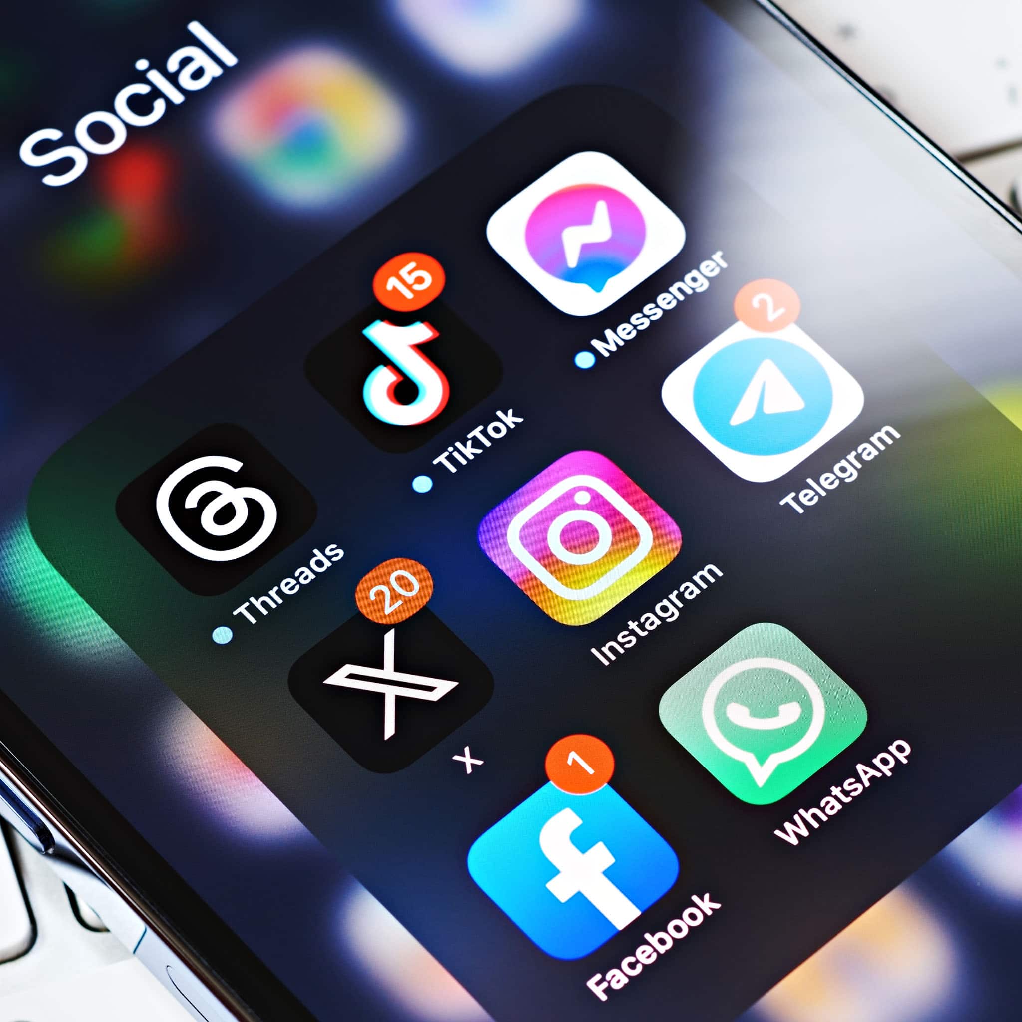 Smartphone screen displaying popular social media apps with notification badges