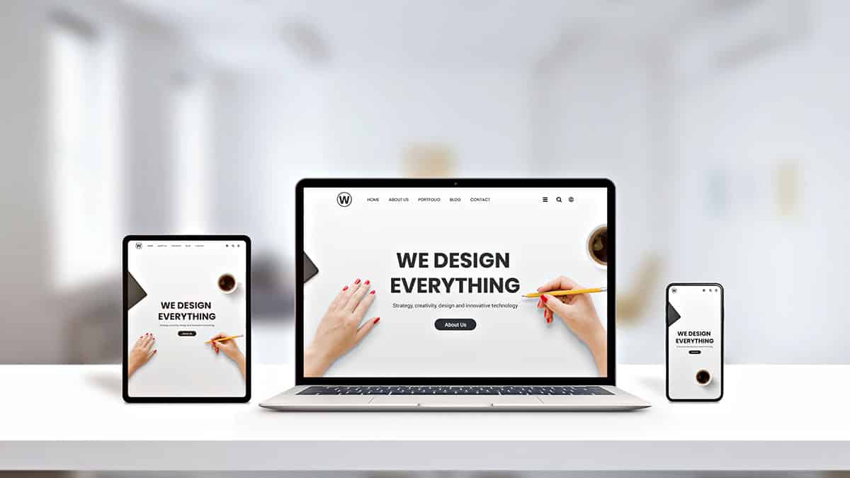 Responsive website design displayed on laptop, tablet, and smartphone screens