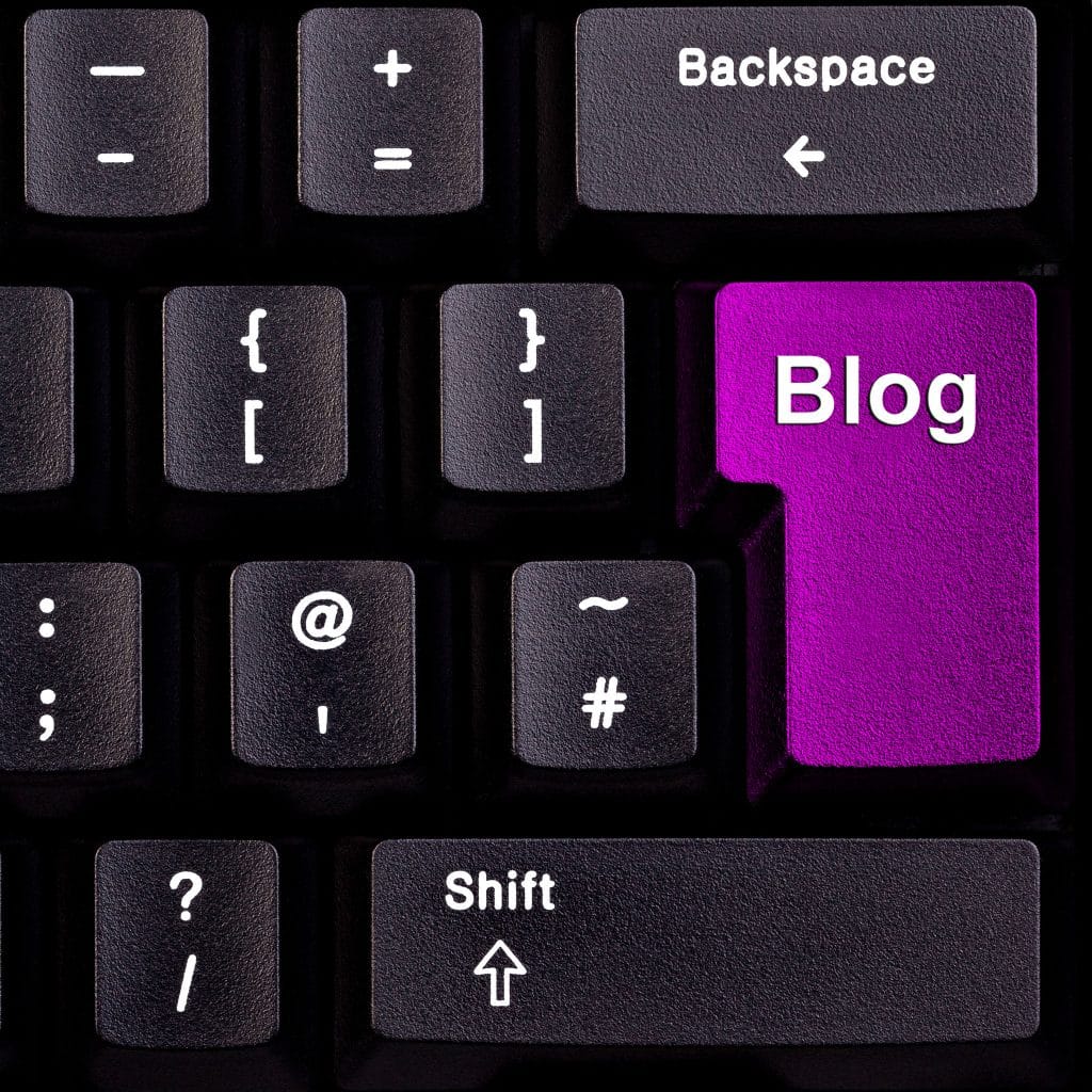 Keyboard with purple 'Blog' key among black keys