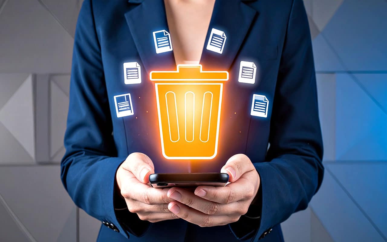 Businesswoman holding digital trash bin with floating document icons