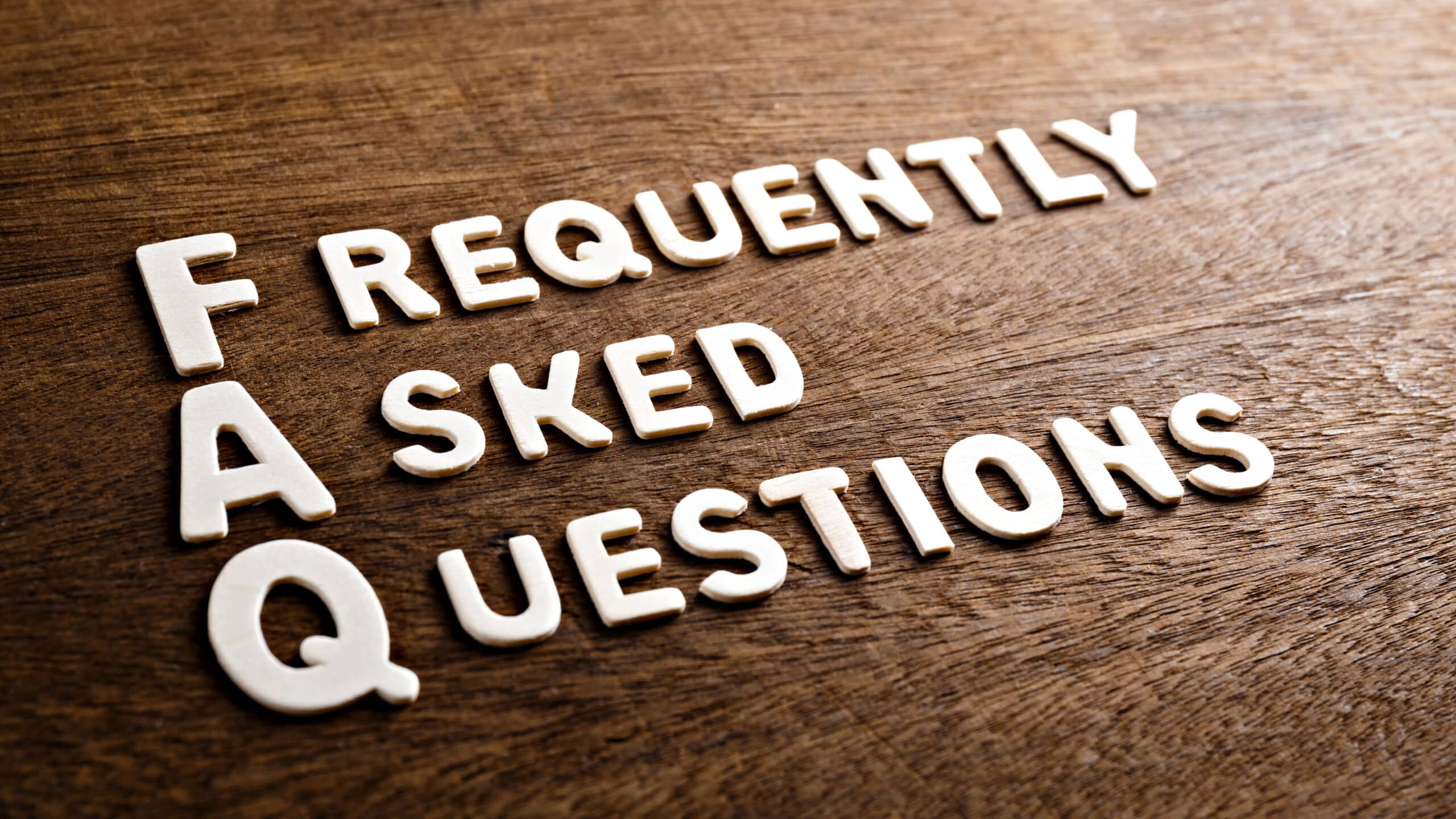 Frequently Asked Questions letters on wooden surface
